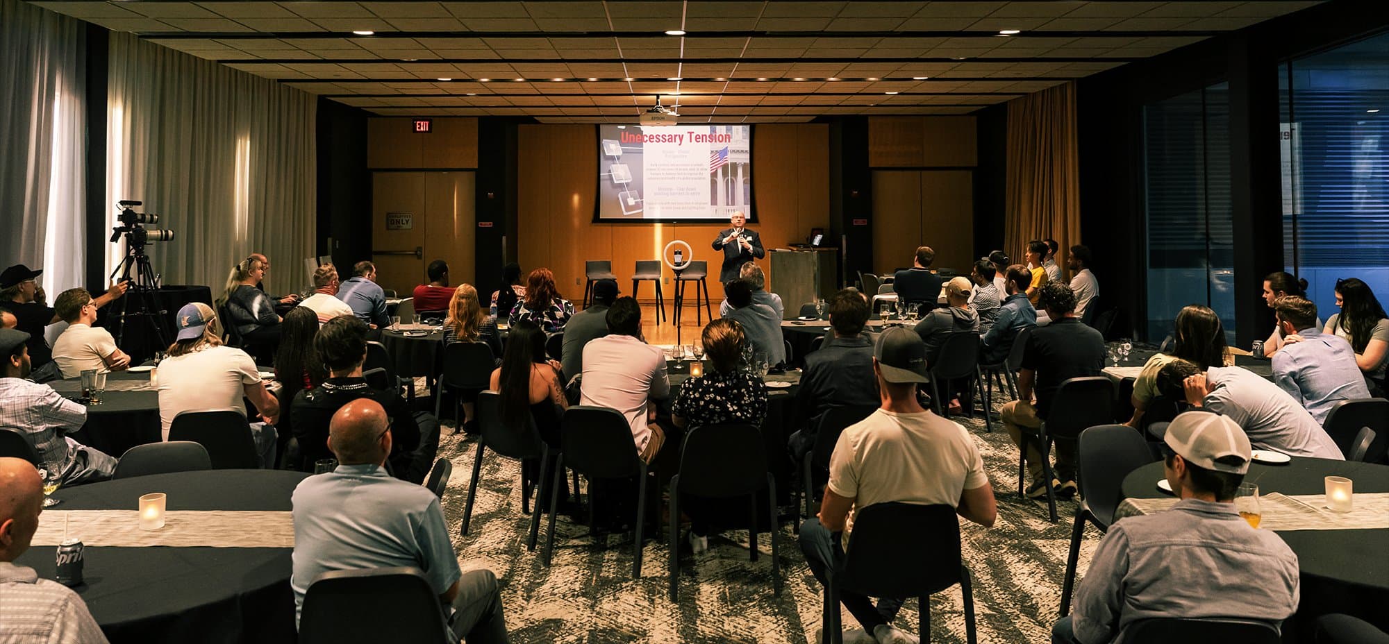 MNblockchain event attendees listening to a speaker